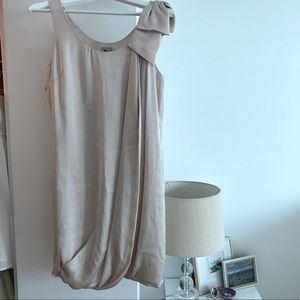 H&M cocktail dress in Champagne. Bow detail at shoulder. Size 4